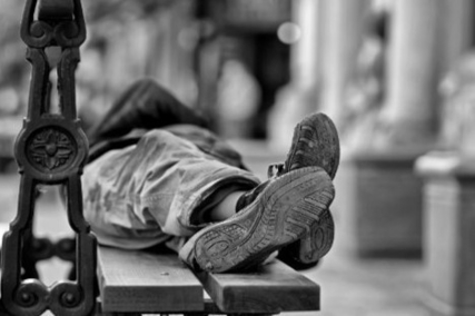 Man lying on bench